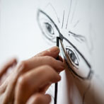 Lyn Carruthers making a self portrait in her studio in 2019